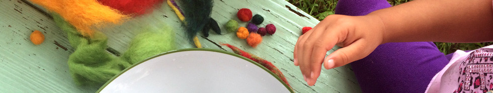 Young visitors to the museum make felt beads from dyed wool